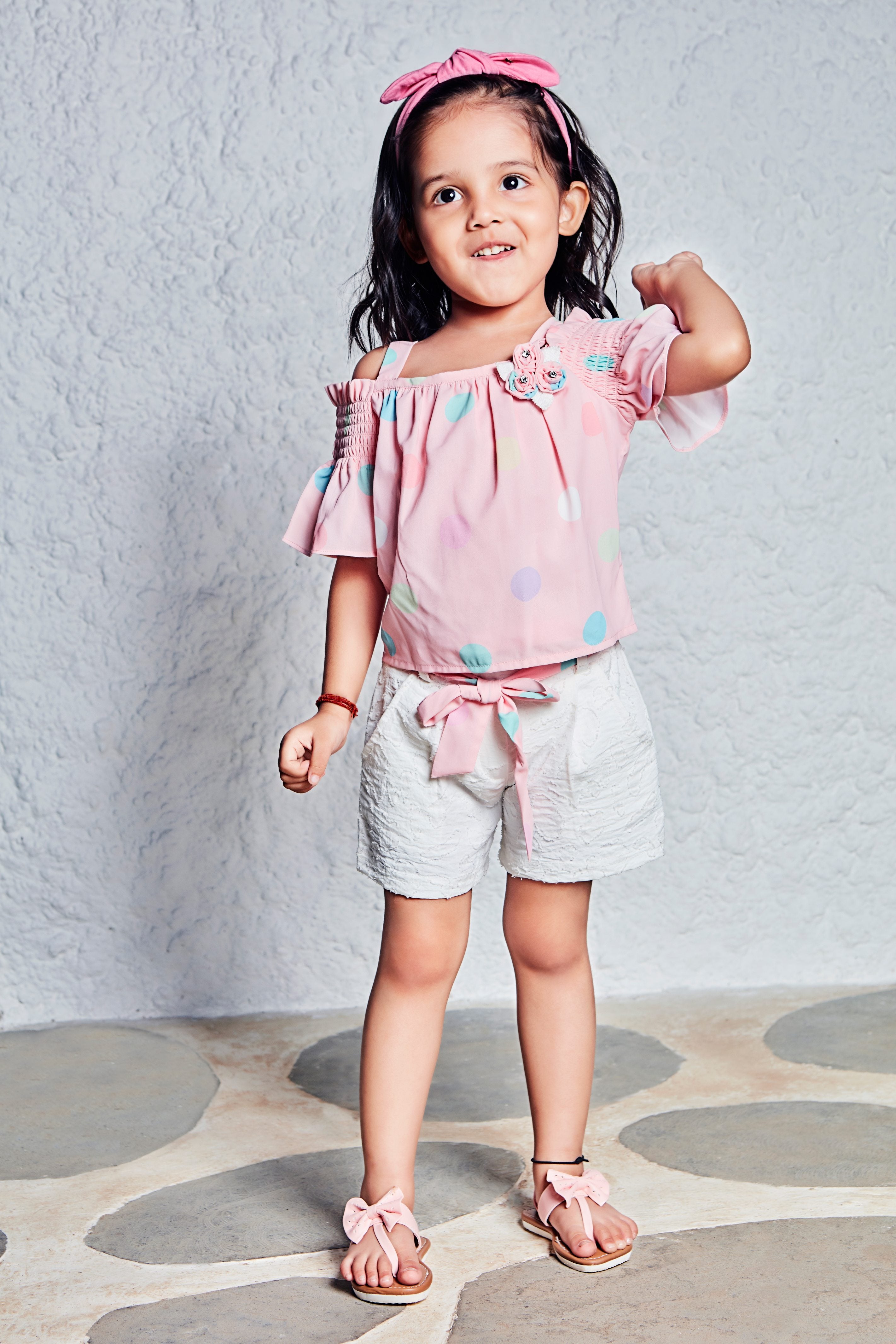 Tressel Kids Peach Multicoloured Polka Dotted Top & White Short With Belt & Brooch