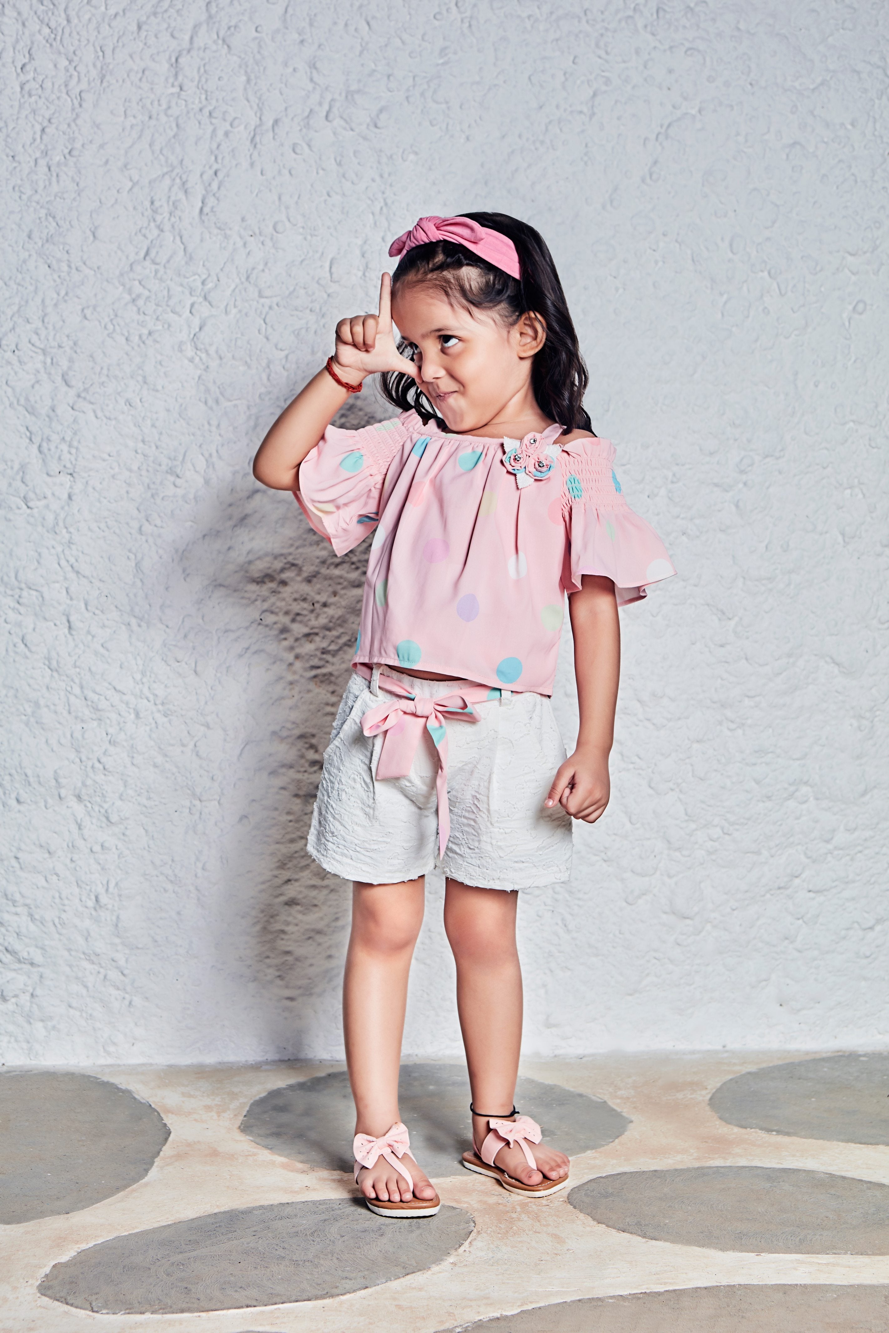 Tressel Kids Peach Multicoloured Polka Dotted Top & White Short With Belt & Brooch